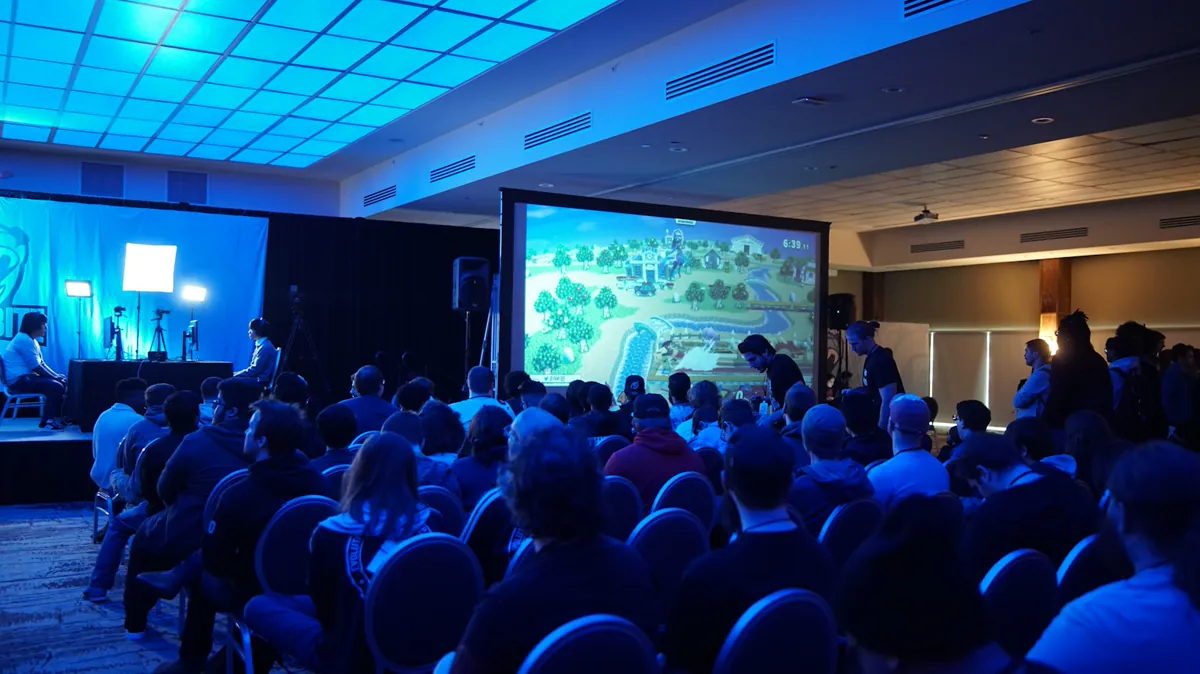 Audience watching a large screen at a conference
